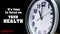 Clock dial close-up with COVID-19 pandemic quote: It\'s time to focus on your health. Table business timer face time lapse.