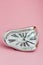 Clock with Distorted Soft Melting Design on Pink Background