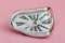 Clock with Distorted Soft Melting Design on Pink Background