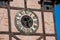 clock face on old wooden tower close up. Ukraine, Chortkiv