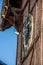 clock face on old wooden tower close up. Ukraine, Chortkiv