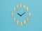 The clock is half of female and half of male figures on a blue background. The concept of periodic generational change