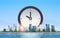 Clock icon time management deadline business timing concept over big modern city building skyscraper cityscape skyline