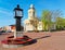 Clock and Lutheran Church of St Nicholas in Ventspils