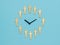 A clock made of figures of men on a blue background. The concept of periodic generational change