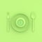 Clock in plate with spoon and fork pastel green color