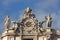 Clock with sculptures at Saint Peter basilica in Vatican