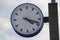 Clock and speaker on a railway station platform in Boskoop, the Netherlands