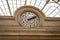 Clock in a stone building facade