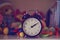 Clock surrounded by colorful toys