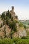 The Clock Tower of Brisighella among the cupressuses vertical