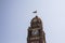 Clock tower with Burmese flag