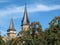 Clock tower and castle tower of the town Oehringen in Germany in autumn