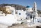 Clock tower and church in Exo Gonia, Santorini