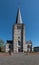 Clock tower of a Gothic parish church of St. Lambertus located on the church square in Heist-op-den-Berg .