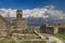 Clock tower in Historical UNESCO protected town of Gjirocaster with a castle on the top of the hill, Southern Albania