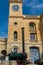 Clock tower of Malta Maritime Museum with old steam engine in front