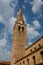 Clock tower of the Romanesque church in the center of Grado