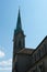 Clock on the tower of St. Peter`s Church in Zurich and a part of the main building of the church