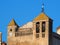 Clock towers and bell tower of the church of sant miquel de miralcamp, lerida, spain, europe