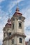 Clock towers Minorite church at Eger main square in Hungary