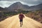 Clocking some fitness hours along the scenic route. Portrait of a young man out for a trail run.