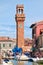 Clocktower, colorful houses and canal on the island of Murano near Venice