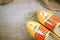 Clogs dutch Volendam, Amsterdam, Marken, wooden shoes at wooden background with hessian burlap and hay straw with copy space for y