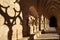 Cloister of the Fontfroide Abbey with shadows on the wall, Languedoc-Roussillon, France