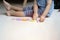 Clopped image of little toddler boy playing with colorfull alphabets collection on the floor