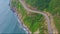 Close Aerial View of Coast Highway along Azure Ocean