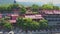 Close Aerial View Pagoda Red Roofs against Hills