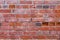 Close ancient red brick wall shabby aged