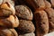 Close Artisanal bread loaves stacked on table- horizontal