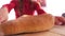 Close blurred image woman pulls board with khachapuri