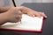 Close of children hands writing on excercise book