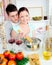 Close couple preparing spaghetti and drinking wine