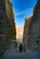 : Close entrance to one of the tombs of the valley with tourists