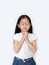 Close eyes beautiful little asian child girl praying isolated on white background. Spirituality and religion