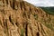 At close of the famous Stob Pyramids with unusual shape red and yellow rock formations, green bushes and trees around