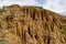 At close of the famous Stob Pyramids with unusual shape red and yellow rock formations, green bushes and trees around