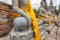 Close focus on hand of meditating monk statue