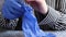 Close the hands of a woman in blue gloves to prevent transmission of pathogens that protect themselves from outbreaks and pandemic