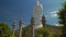 Close Large White Buddha Statue High Columns in Temple Park