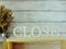 Close letters word alphabet with dried flowers on wooden background