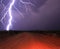 Close Lightning Strike in the Desert on a Dirt Road