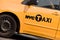 Close on the logo of a yellow NYC Taxi in New York