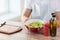 Close of male hand holding a bowl with salad