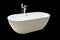 Close new white bathtub isolated on black