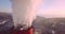 Close panoramic view of Central Heating and Power Plant chimney top with steam